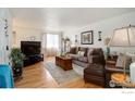 Inviting living room with comfortable seating, natural light, and stylish decor at 1420 Hover St # 2, Longmont, CO 80501