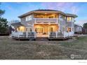 Expansive backyard featuring a multi-level deck, perfect for entertaining or relaxing outdoors at 2527 Columbine Cir, Lafayette, CO 80026