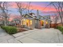 Beautiful home featuring manicured landscaping, a long driveway, and an inviting front entrance at 1013 Mapleton Ave, Boulder, CO 80304