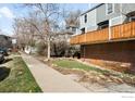 Street view showing brick facade townhomes, sidewalk, landscaping and a view of neighboring homes at 1111 Maxwell Ave # 231, Boulder, CO 80304