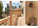 Charming outdoor space featuring a wooden deck and exterior details at 12023 Coal Creek Heights Dr, Golden, CO 80403