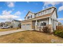 Lovely home featuring a well-maintained lawn, brick accents, and an attached two-car garage at 16478 Marion St, Thornton, CO 80602