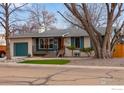 Charming home exterior with well-maintained landscaping, updated porch, and curb appeal creating a welcoming entrance at 1700 Jewel Dr, Longmont, CO 80501