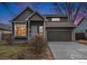 Charming home with a two-car garage during twilight at 180 N Holcomb St, Castle Rock, CO 80104