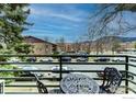 Serene balcony view with seating overlooking the cityscape and mountains at 1825 Marine St # 8, Boulder, CO 80302