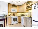 Lovely kitchen featuring wooden cabinets, modern appliances and lots of lighting at 1825 Marine St # 8, Boulder, CO 80302