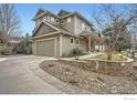 Lovely home featuring a side-entry garage, stone accents, and a well-manicured front yard at 2040 Oak Ave, Boulder, CO 80304