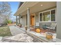 Inviting front porch with comfortable seating, decorative plants, and a stylish entrance at 2040 Oak Ave, Boulder, CO 80304