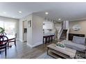 Open-concept living area showcasing seamless flow between the dining area, living room, and kitchen at 2136 S Balsam Ct, Lakewood, CO 80227