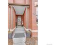 Inviting entryway with stylish decor, planters, and a welcoming front door at 2890 Curtis St, Denver, CO 80205