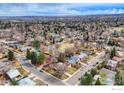 Sprawling aerial view of a neighborhood showcasing tree-lined streets and a mix of single-Gathering homes at 3690 Conifer Ct, Boulder, CO 80304