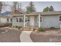 Close-up of a charming single story home, showing the front porch and landscaping at 419 22Nd St, Boulder, CO 80302