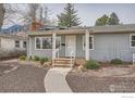 A charming house featuring a well-maintained exterior with gray siding and a welcoming front entrance at 419 22Nd St, Boulder, CO 80302