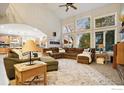 Inviting living room featuring large windows and modern furnishings at 9092 Fieldcrest Ln, Longmont, CO 80503