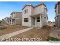 Newly constructed modern home with sidewalk access and fresh landscape ready to be designed at 1051 Spartan Ave, Berthoud, CO 80513
