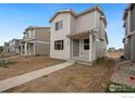 Newly constructed modern home with sidewalk access and fresh landscape ready to be designed at 1051 Spartan Ave, Berthoud, CO 80513