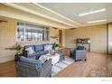 Inviting sunroom featuring cozy seating, natural light, and a welcoming atmosphere at 169 Emerald St, Broomfield, CO 80020