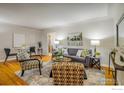 Cozy living room with hardwood floors, stylish furnishings, and plenty of natural light at 169 Emerald St, Broomfield, CO 80020