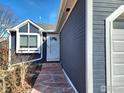 Inviting home entrance featuring a stone walkway and well-manicured landscaping at 1754 Linden St, Longmont, CO 80501