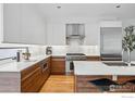 A modern kitchen design with stainless steel appliances and marble backsplash at 1916 23Rd St, Boulder, CO 80302