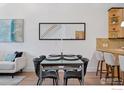 Stylish dining area with modern table setting, artistic accents, and adjacent bar seating at 2060 23Rd St # 2, Boulder, CO 80302