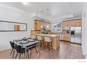 Open concept kitchen featuring an island, granite countertops, and stainless steel appliances at 2060 23Rd St # 2, Boulder, CO 80302