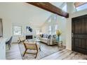 Bright living room boasts high ceilings, fireplace, and abundant natural light through many windows at 2650 Hawthorne Pl, Boulder, CO 80304