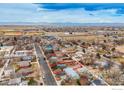 Wide aerial shot showcasing the home's placement in the neighborhood and its proximity to the highway at 329 2Nd St, Frederick, CO 80530