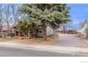Attractive home boasting green siding and inviting wooden porch at 329 2Nd St, Frederick, CO 80530