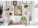 Close up of stylish decor, including an eclectic gallery wall, plants and elegant furnishings at 3299 Lowell Blvd # 103, Denver, CO 80211