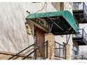 Inviting entrance with a stylish awning and well-maintained front door and steps at 3299 Lowell Blvd # 103, Denver, CO 80211