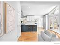 Open floor plan showcasing kitchen with large island, and seamless flow into the living area at 3380 Longwood Ave, Boulder, CO 80305