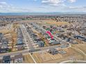 Aerial view of a neighborhood surrounded by open space, with subject house indicated at 4764 Kipp Pl, Brighton, CO 80601
