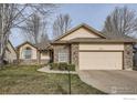 Beautiful single-story home with stone accents, two-car garage, and a well-manicured front yard at 7051 Johnson Cir, Niwot, CO 80503