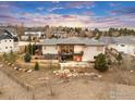 Gorgeous backyard featuring a patio, lush landscaping, and beautiful sunset views at 8568 Foxhaven Ct, Niwot, CO 80503