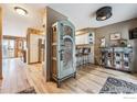 Open-concept living area with hardwood floors and abundant natural light at 148 S Holman Way, Golden, CO 80401