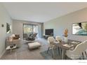Open-concept living and dining area, perfect for entertaining with walk out balcony at 2227 Canyon Blvd # 360, Boulder, CO 80302