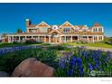 Beautiful home with wrap-around porch and lush landscaping at 2300 N 75Th St, Boulder, CO 80301