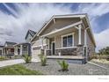 Charming single-Gathering home featuring stone accents, neutral siding, and well-maintained landscaping at 2711 Crystal Springs Ln, Longmont, CO 80503