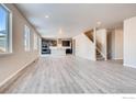 Spacious living room with large windows and hard surface floors at 2718 Crystal Springs Ln, Longmont, CO 80503