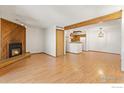 Comfortable living area featuring wood-burning fireplace and seamless transition to kitchen at 2992 Shadow Creek Dr # 203, Boulder, CO 80303