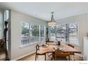 Bright dining area featuring hardwood floors, modern lighting, and expansive windows at 3228 47Th St, Boulder, CO 80301