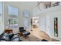 Spacious living room featuring hardwood floors, vaulted ceiling, and abundant natural light at 3228 47Th St, Boulder, CO 80301