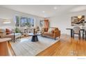 Stylish living room with a large window, wood floors, and a neutral color palette at 345 S 42Nd St, Boulder, CO 80305
