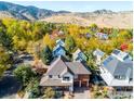 Beautiful home nestled in a vibrant neighborhood surrounded by colorful trees and scenic mountain views at 3953 Springleaf Ln, Boulder, CO 80304