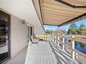 Spacious covered patio with pond view, seating, and ample space for outdoor entertaining at 43 Scott S Dr, Broomfield, CO 80020
