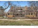 Townhome building featuring a walkway and balconies at 4799 White Rock Cir # D, Boulder, CO 80301