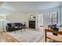 Bright living room featuring a fireplace and hardwood floors at 4799 White Rock Cir # D, Boulder, CO 80301