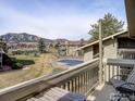 Balcony view features seating and distant mountain scenery at 695 Manhattan Dr # 213, Boulder, CO 80303