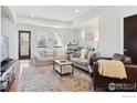 Bright living room showcasing a neutral palette, large windows, and open layout at 1944 Arapahoe Ave # C, Boulder, CO 80302